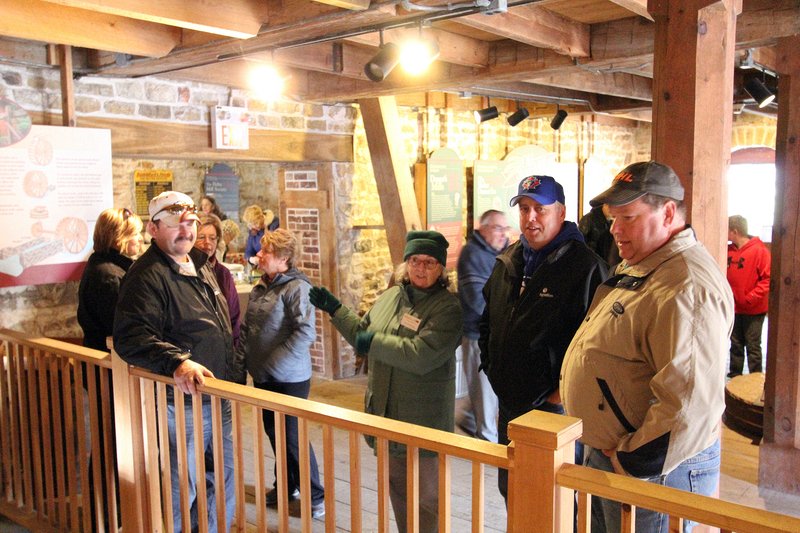 Sally Wanless (center) guided many tours of the mill during the day.  Delta Harvest Festival 2015