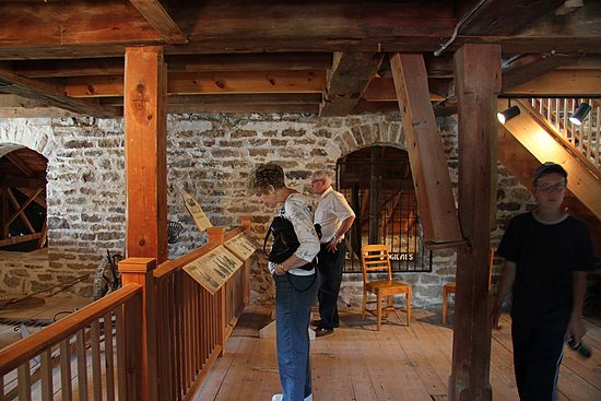 Visitors learn about milling in the beautiful ambiance of the Old Stone Mill
